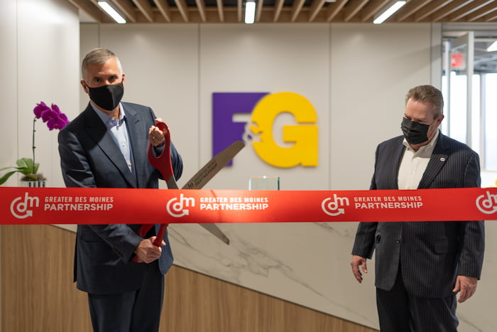 Image of F&G CEO Chris Blunt cutting a red ribbon