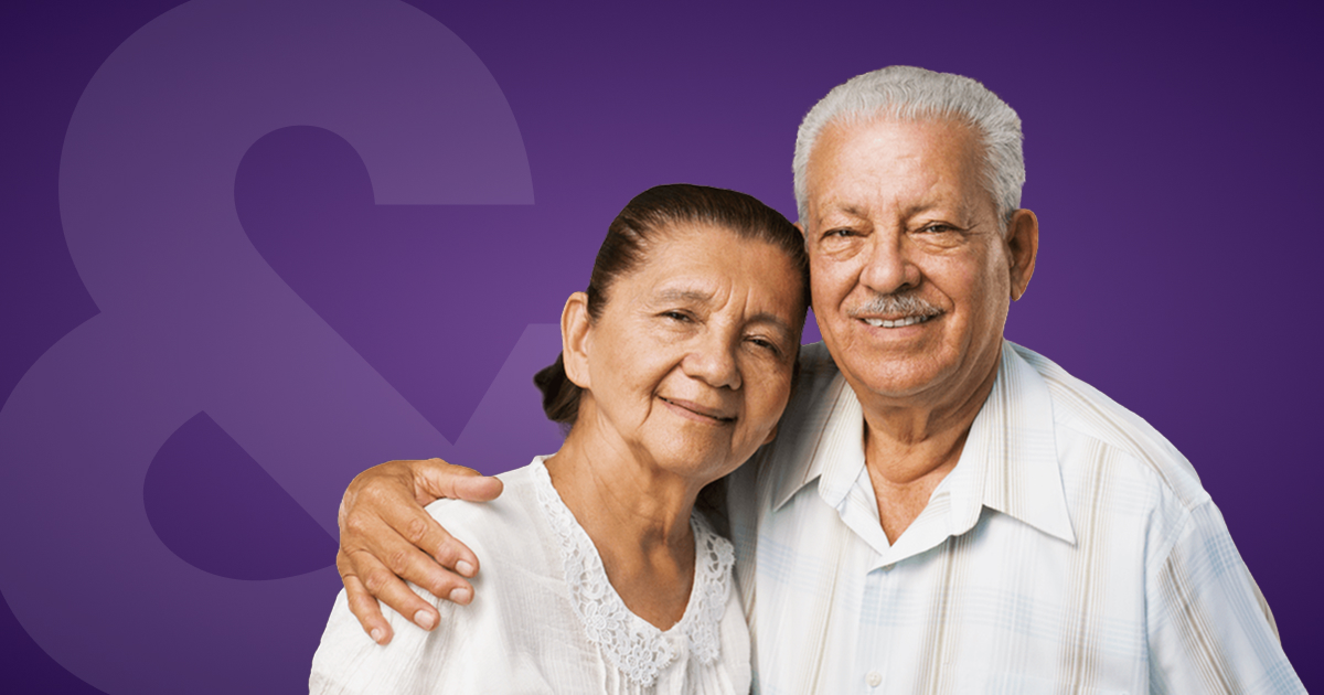 A retired couple smiling together